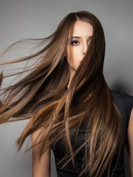 A facelift and neck lift cosmetic surgery made a woman look younger and more attractive.